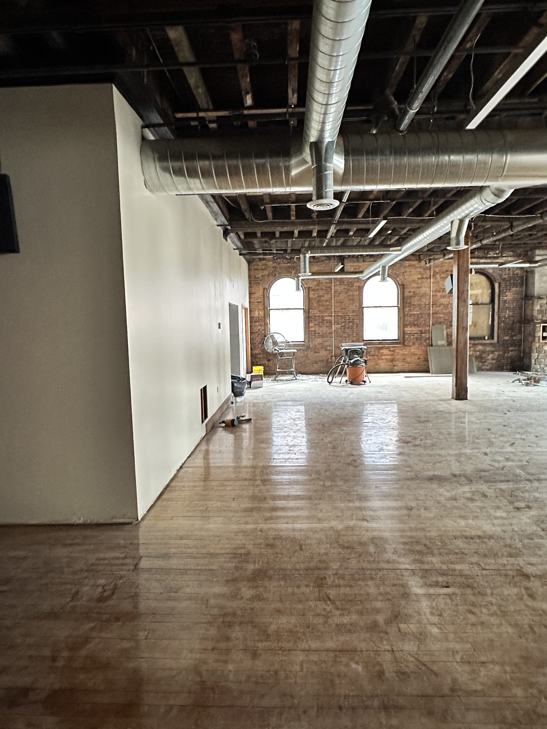 Ductwork running toward the arched windows
